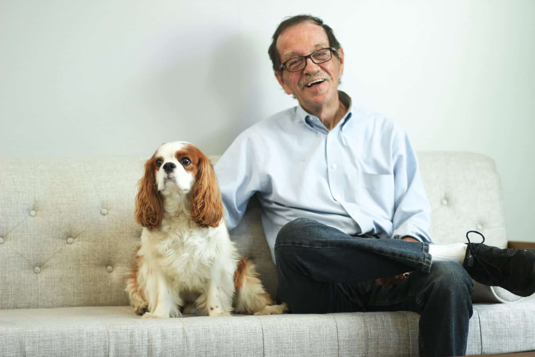 Man with dog on Sofa